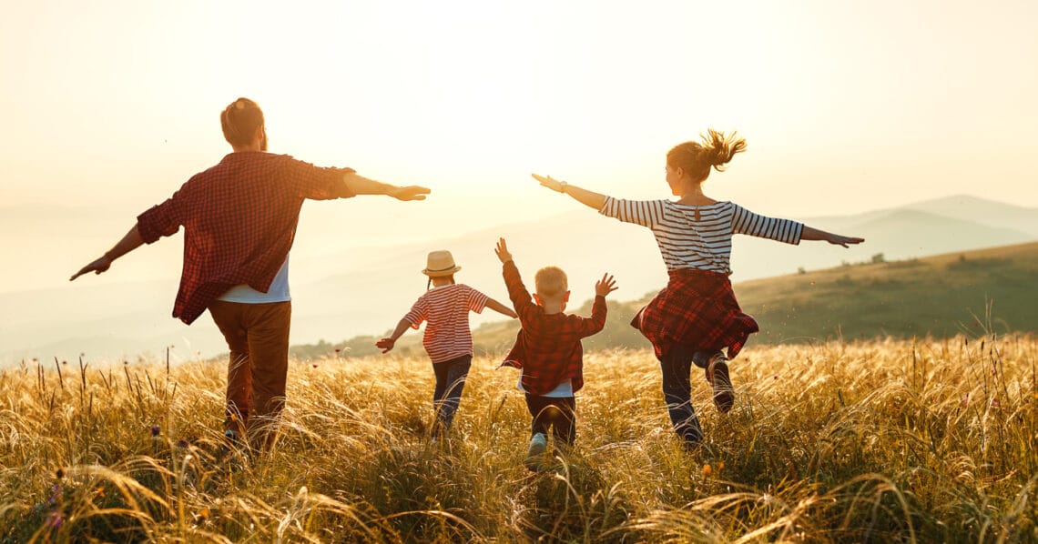 Family walking through a field
